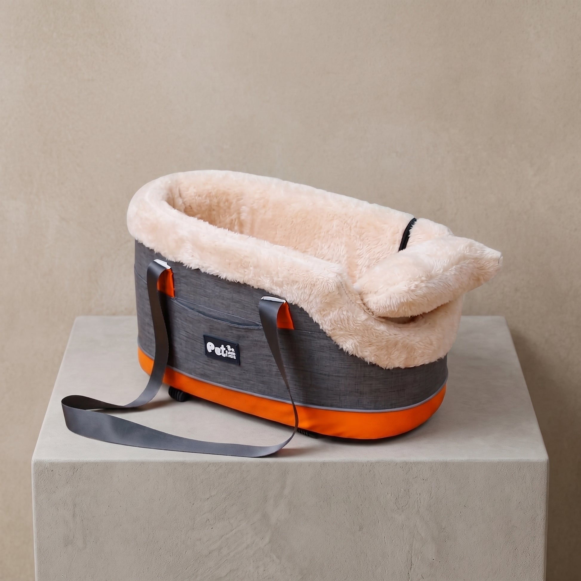 Pet Car Center Console Carrier, studio pedestal shot in grey with orange trim